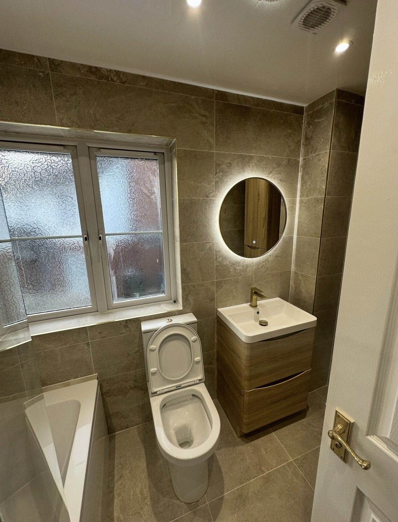 Completed bathroom with LED mirror